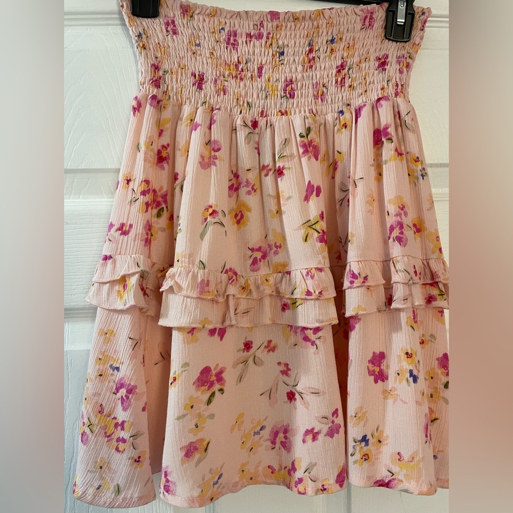 NWT Junior skirt with pink background and dark pink flowers. Smocked waistband.